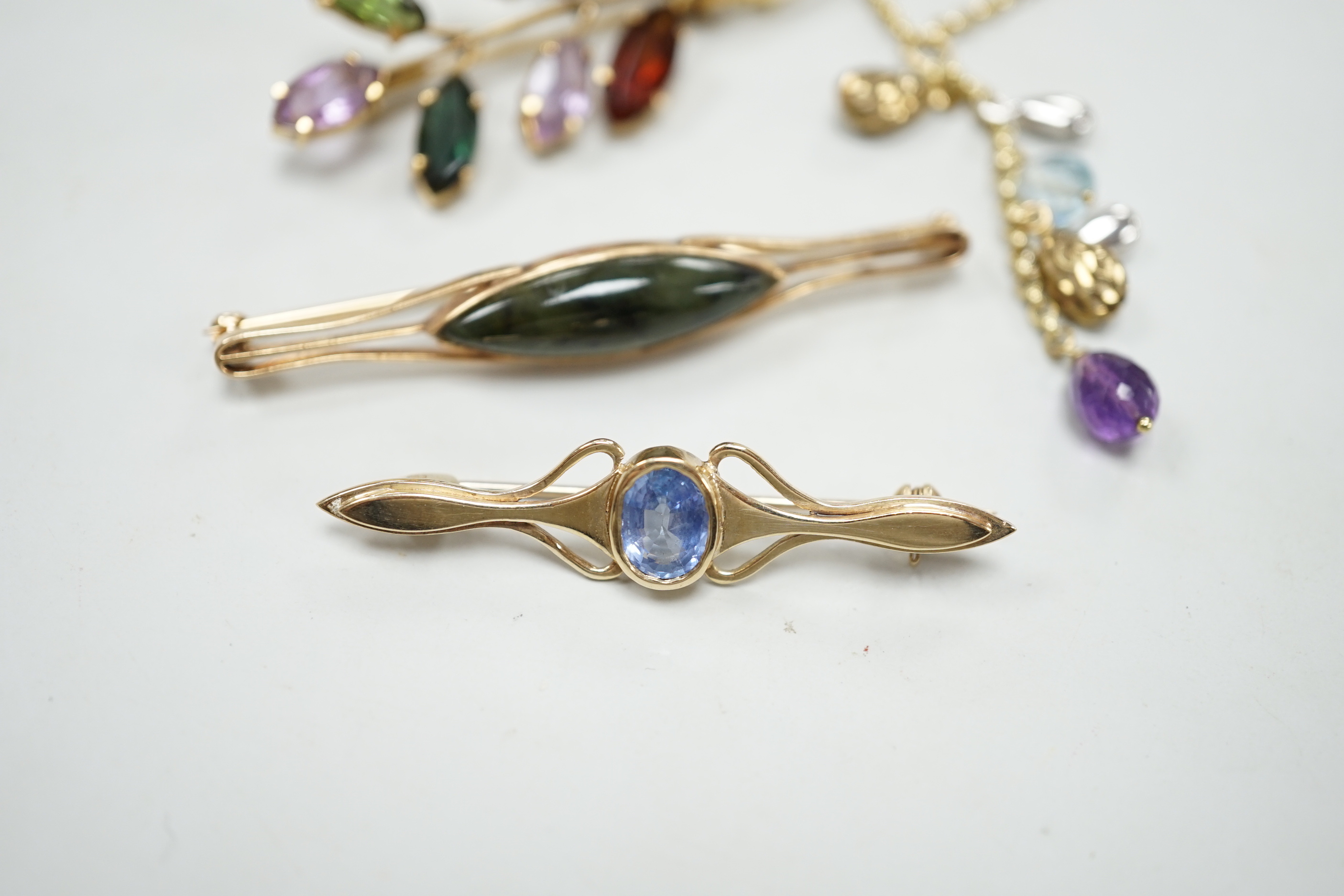 Three modern yellow metal and gen set brooches including 9ct gold and a modern 9ct gold and gem set necklace, gross weight 16.8 grams.